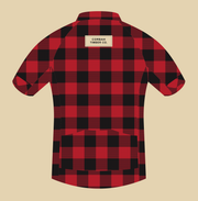 Back artwork of The Lumberjack jersey: red and black buffalo check, tan CORBAH TIMBER CO. label and three rear pockets.
