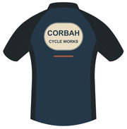 Back artwork of The Mechanic jersey: large cream CORBAH CYCLE WORKS oval badge with a rust dash below, on navy with charcoal sleeves and sides.