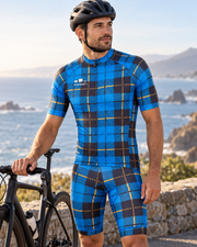 Rider in the Scotsman plaid jersey, shown with the matching bib shorts (sold separately), at a coastal overlook