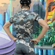 Back of the Weekend Warrior camo jersey worn by a rider in front of a colorful mural.