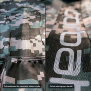 Close-ups of the sublimated digital camo fabric and the Corbah lettering on the side of the jersey.
